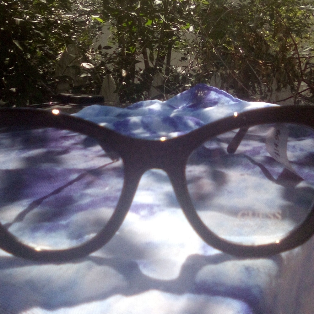 Women's sunglasses made by Guess